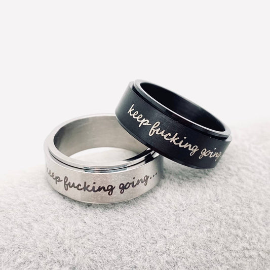 Rotatable Stainless Steel Ring "Keep Fucking Going"